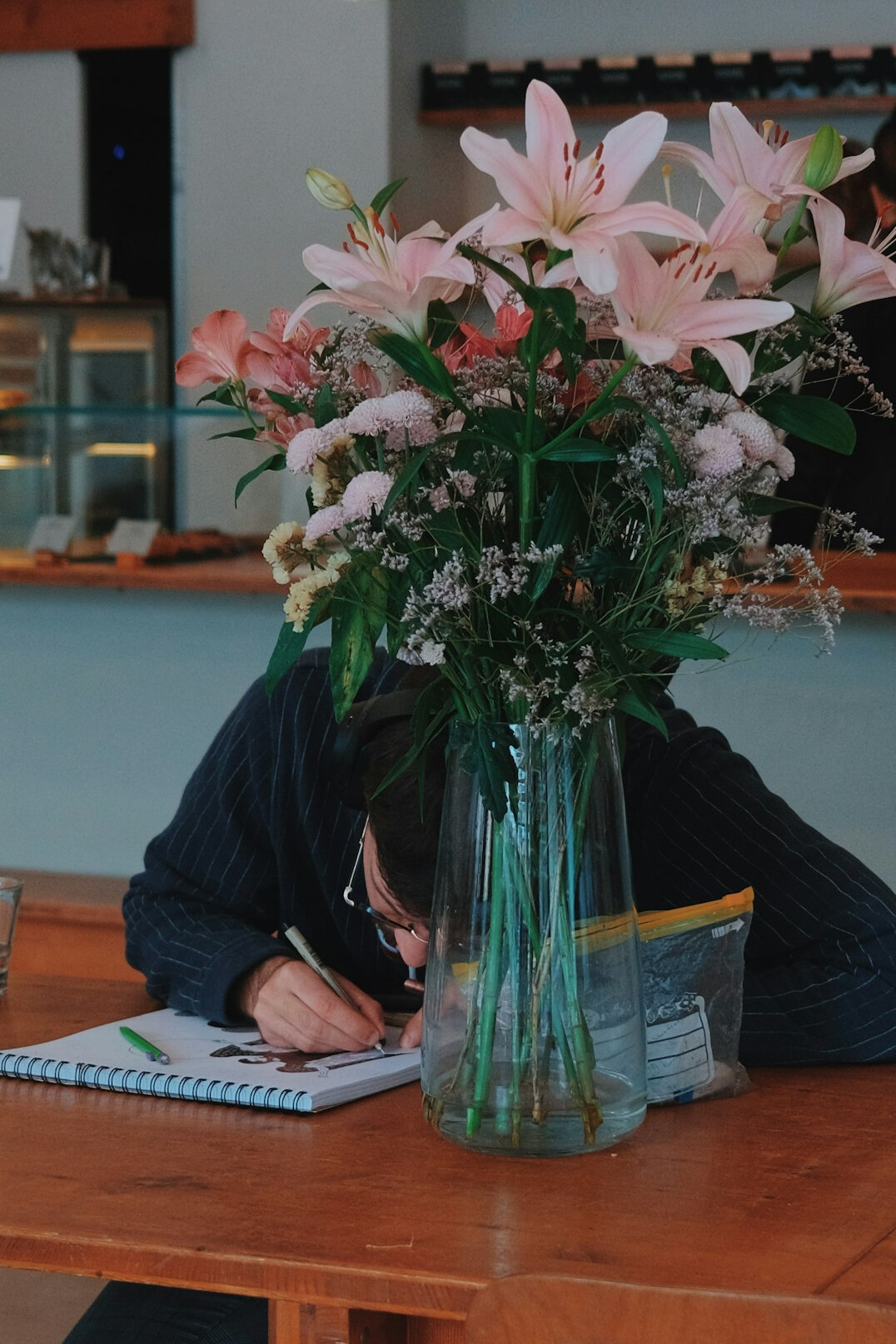 Trainee taking notes during an editorial workshop